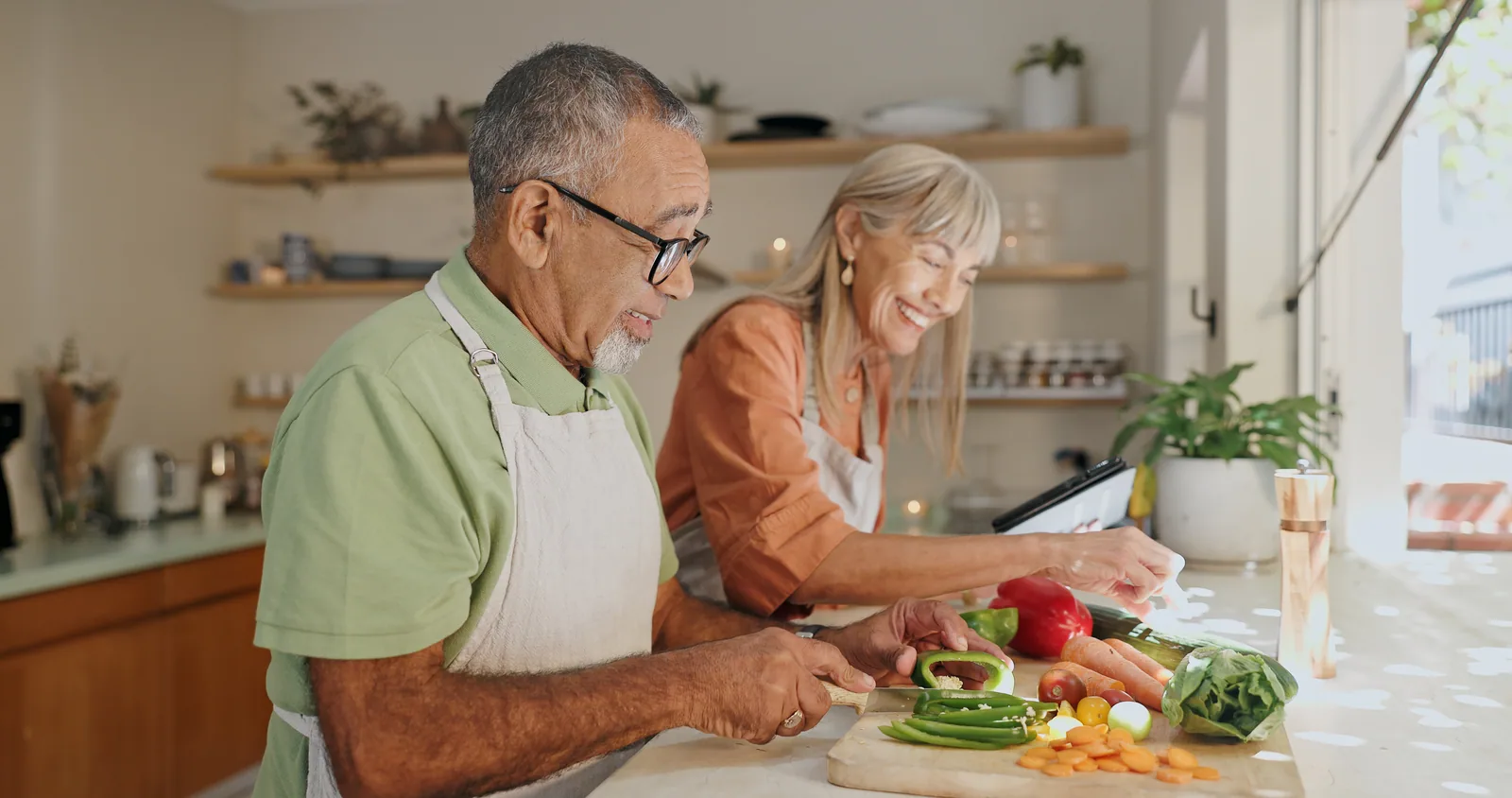 Couple cooking with fresh vegetables