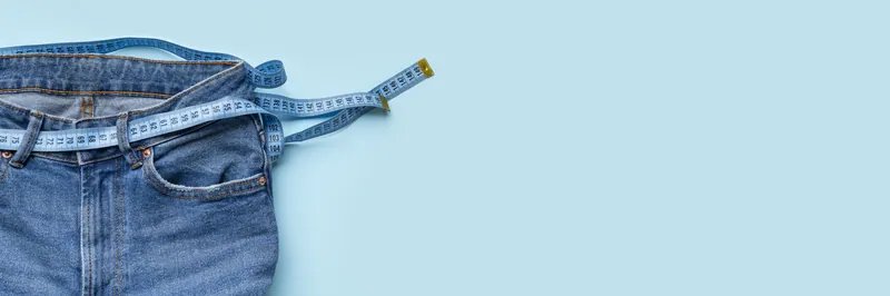 Jeans with a measuring tape belt