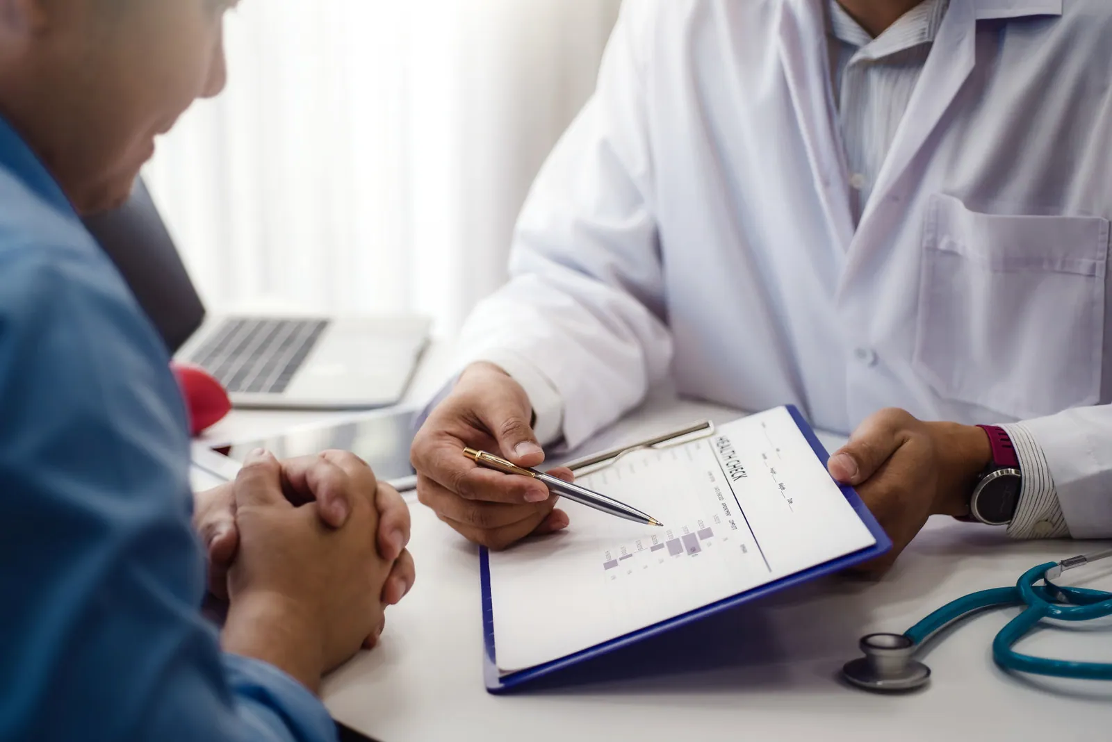 Doctor explain health check document of male patient in medical clinic or hospital mental health. health and doctor concept.