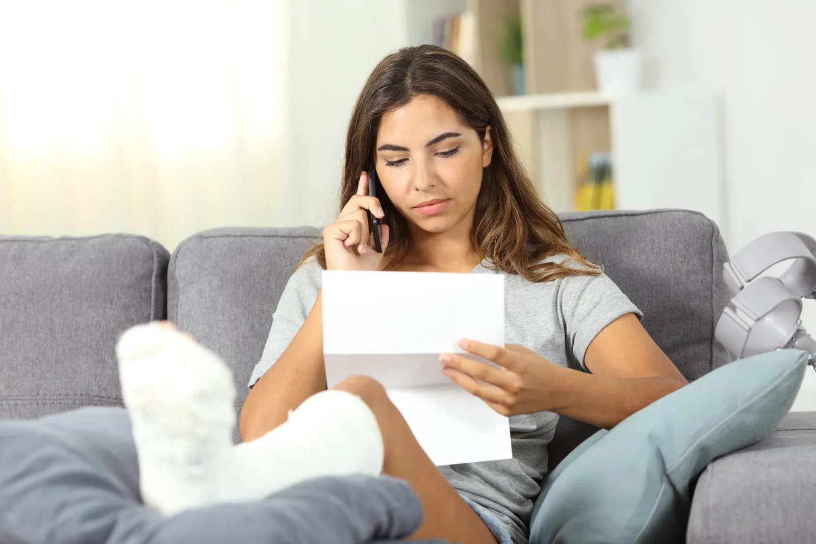 Disabled woman calling on phone about a letter
